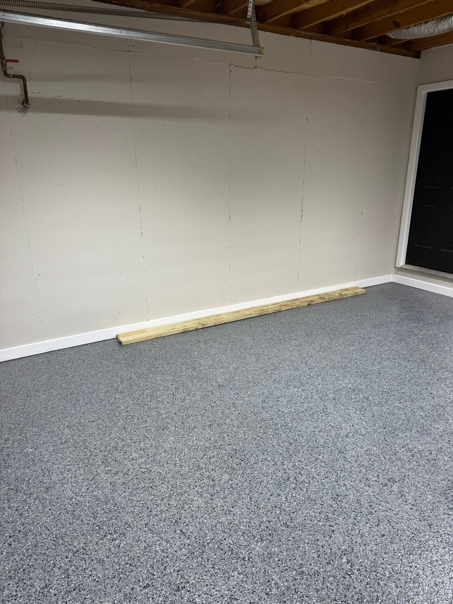 Finished gray flake epoxy garage floor