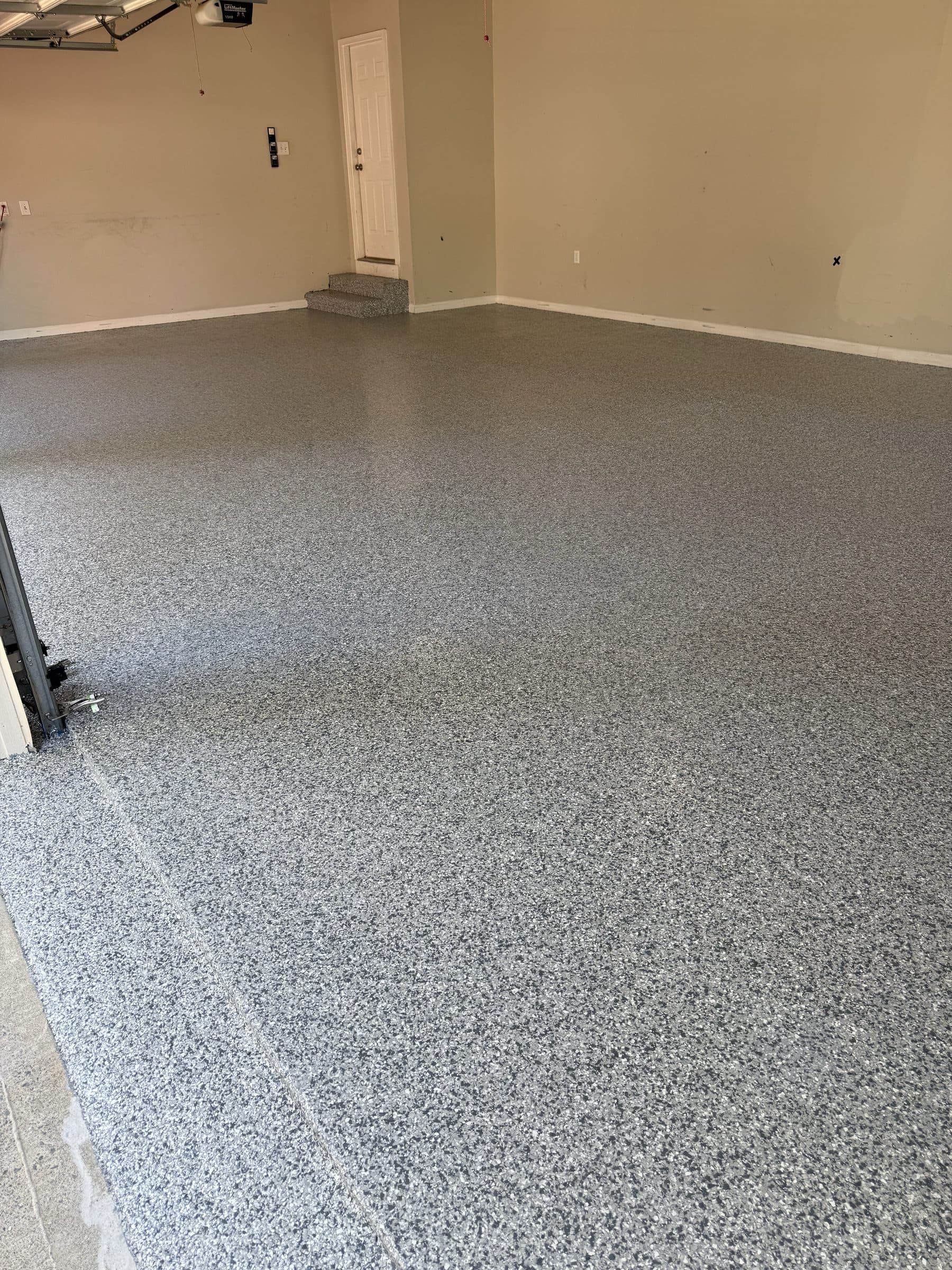 Finished gray flake epoxy garage floor